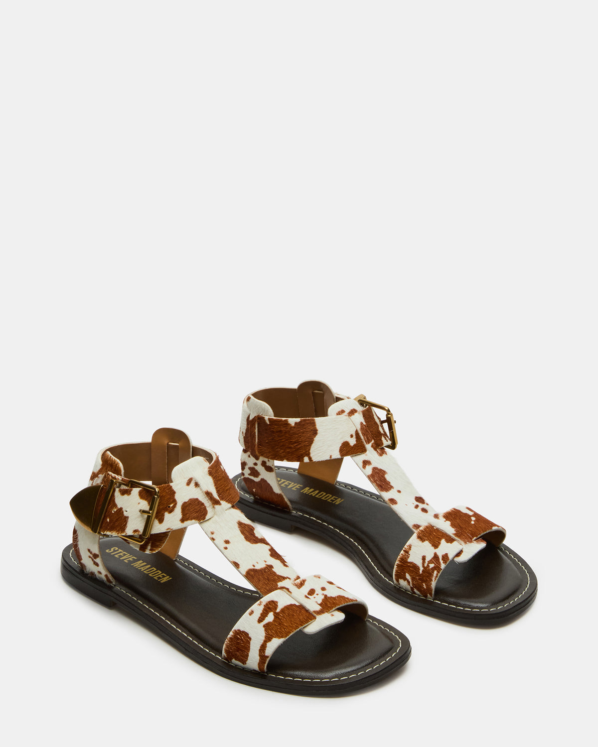 BRAZINN Brown Cow Print Strappy Flat Sandal Women's Sandal | Steve Madden
