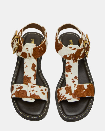 BRAZINN Brown Cow Print Strappy Flat Sandal Women's Sandal | Steve Madden
