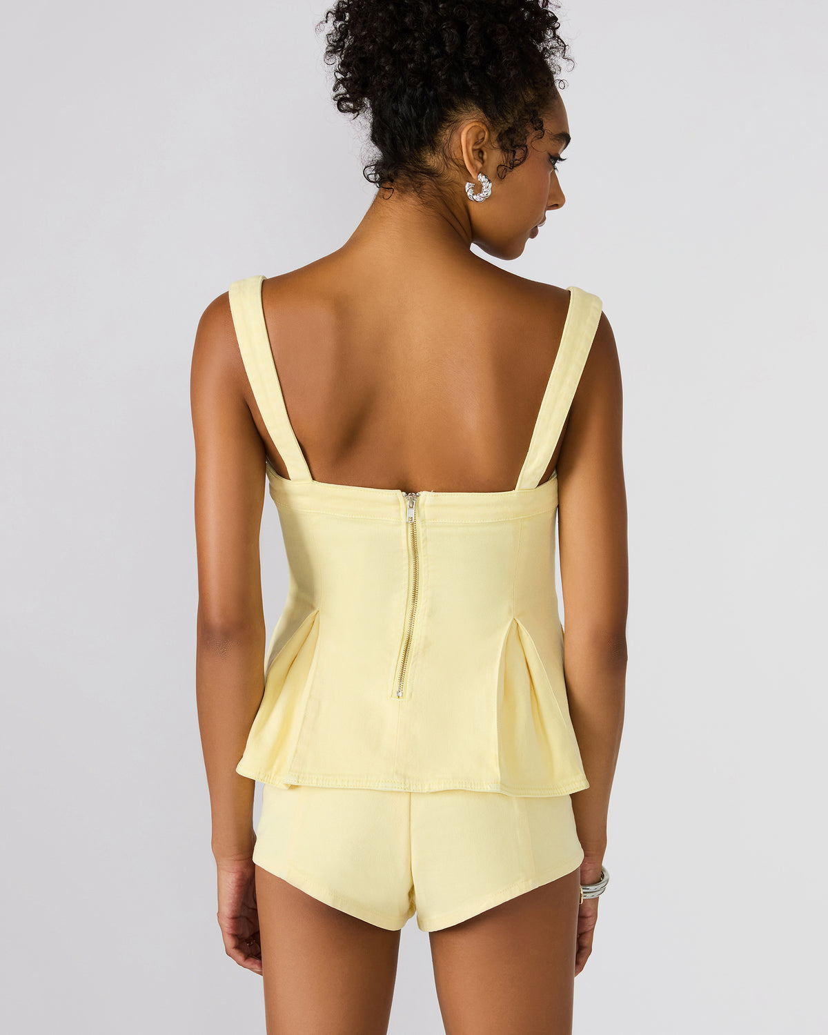 ZENIA Golden Glow Sleeveless Peplum Women's Top | Steve Madden
